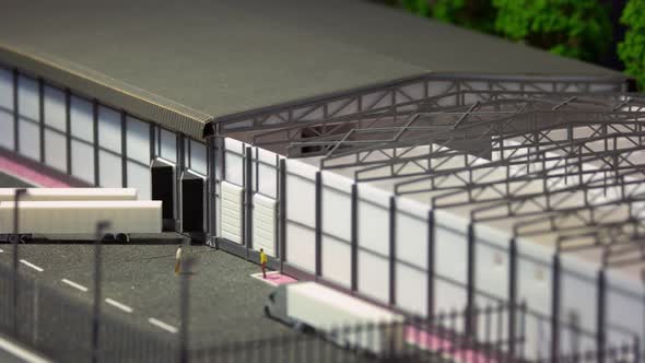Miniature Mockup Project with Warehouse and Trucks
