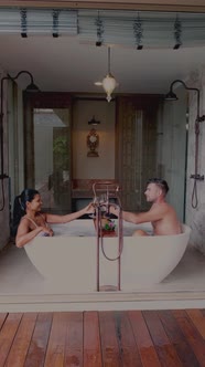 Asian Woman and European Men Relaxing in Bath Tub During Vacation Luxury Holiday in Spa