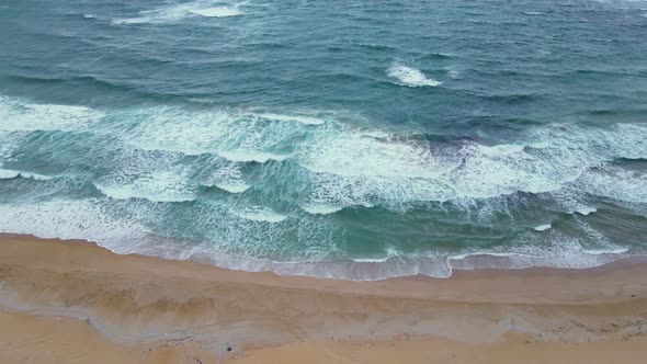 High and powerful waves coming fast to the beach, waves in winter day