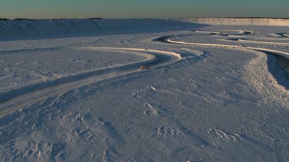 Aerial View of an Ice Rally on a Snowy Track