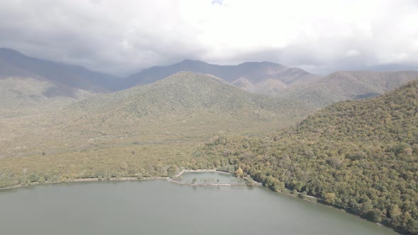 Aerial view of Kvareli lake between autumn forest, Georgia