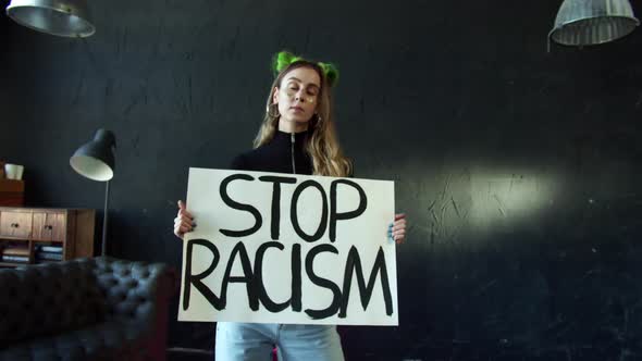 White Activist Girl Protesting with Stop Racism Sign