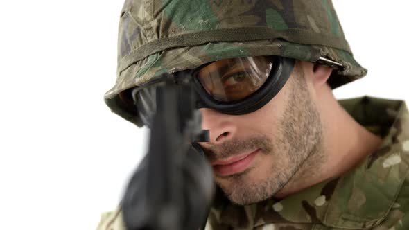 Soldier aiming rifle on white background