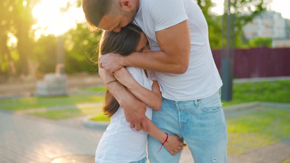 Father Hugs Daughter