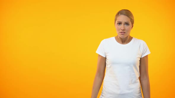 Annoyed Female Showing Face Palm Gesture, Covering Eyes by Hand, Embarrassment