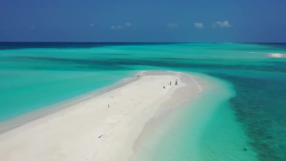 Aerial above texture of relaxing resort beach time by turquoise lagoon with bright sand background o