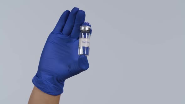 Healthcare Professionals Hand Protective Glove Shows Vial Vaccine Against Rapidly Spreading