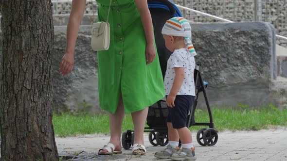 Mother and Child Walking in the Park in Summer Happy 1