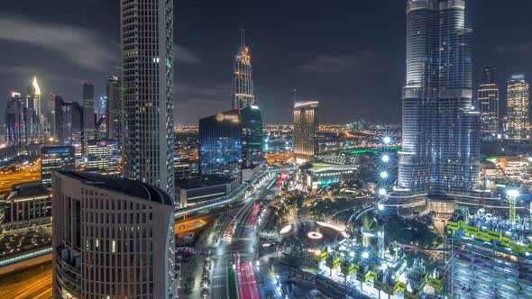 Panoramic Skyline View of Dubai Downtown with Mall Fountains and Skyscrapers Aerial Night Timelapse