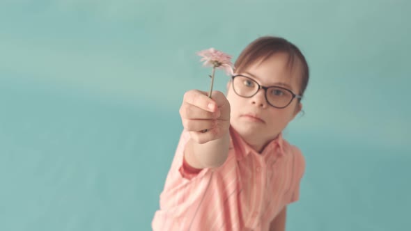 Girl with Down Syndrome Holding Flower