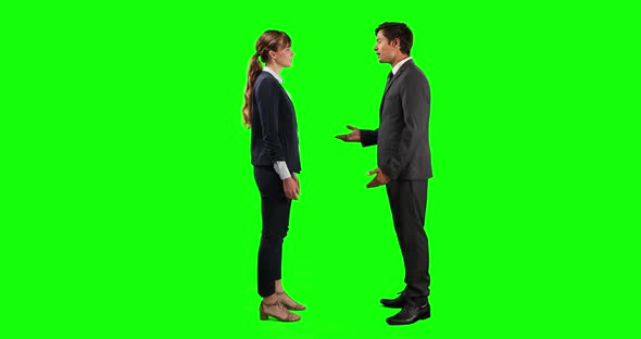 Side view of business people making a deal and shaking their hands with green screen