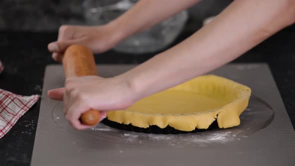 Woman Making French Tart in the Kitchen.