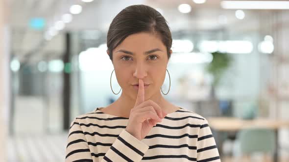Portrait of Indian Woman Putting Finger on Lips, Quiet Sign 