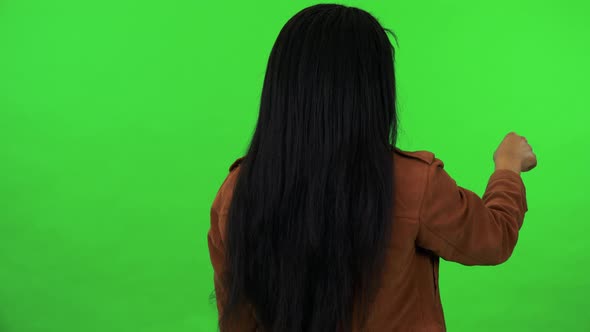 A Black Woman Works on an Interactive Board - Green Screen Studio