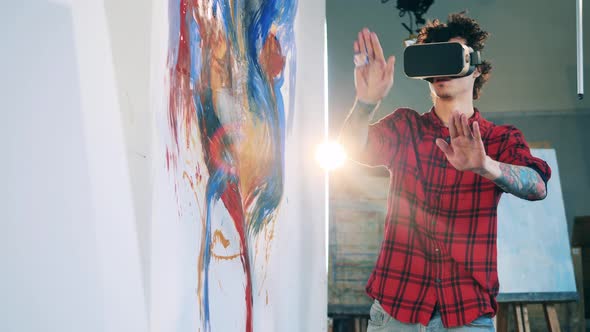 Tattooed Man is Using VRglasses for Painting