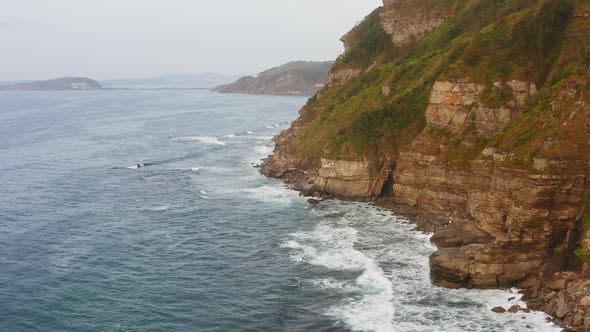 Aerial View of the Picturesque High Coastline Sharp Cliffs and Raging Sea