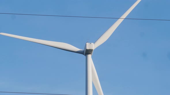 Windmill Farm Wind Electro Eco Energy Turbines on Blue Sky Background on European Pyrenees Mountains