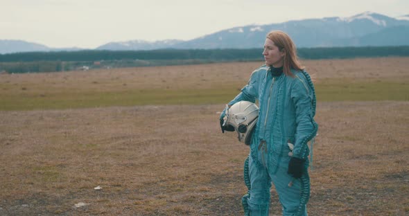 Female Cosmonaut Looking Around Landing Ground