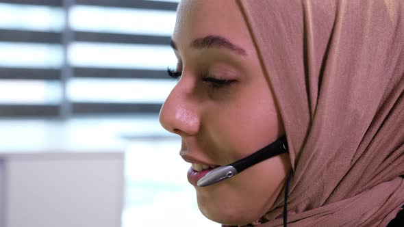 Muslim beautiful woman offers support on the phone.