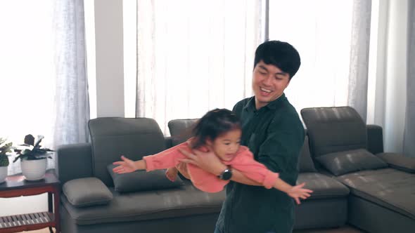 Father Feel Playful Have Fun Engaged In Funny Game With Happy Smiling Little Girl Child