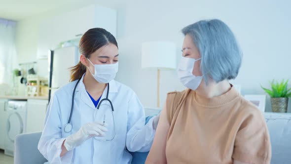 Asian doctor give treatment to Senior elderly woman disabled patient.