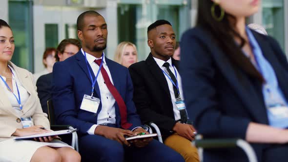 Business people raising their hands in a business seminar 4k