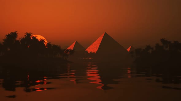 Timelapse of the sunset over the lake and ancient pyramids on the horizon.