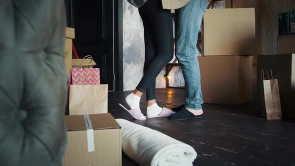 Waist Down of Couple Moving Into New Apartment