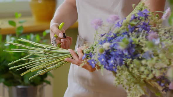 Florist cutting off stems with shears