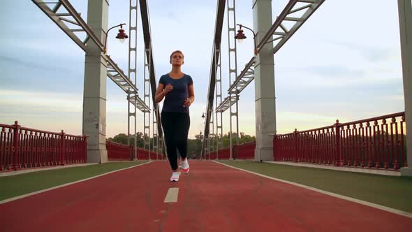 Female Jogging in City Alone