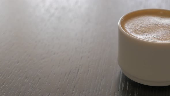 Espresso coffee cup on table panning 4K 2160p UHD video - Delicious coffee cream in the cup 4K 3840X