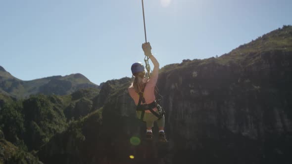 Young Caucasian woman zip lining