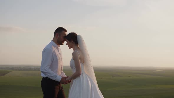 Close Up View of Bride and Groom That Kiss