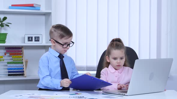 Kids Are Printed in the Laptop and View Graphs of the Blue Folder