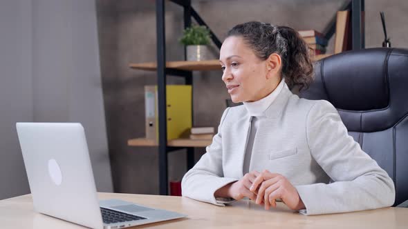 Business Woman Has Video Conference with Partners