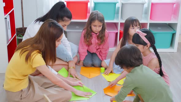 Asian beautiful young woman teacher teaching a lesson to kid at school.