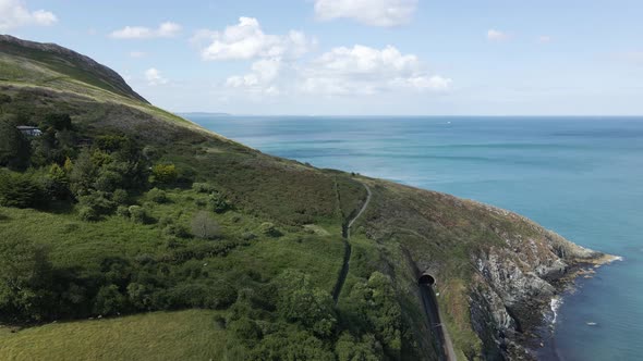 The Beautiful Irish Rocky Coast Near Dublin And Bray Town Surrounded By The Calm Blue Ocean During S