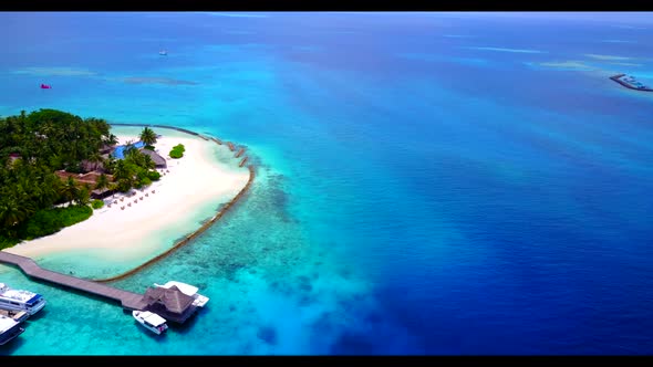 Aerial above scenery of exotic island beach journey by blue water with white sandy background of a d