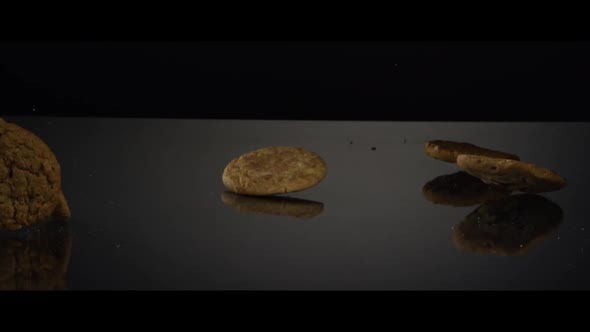 Falling cookies from above onto a reflective surface - COOKIES 245