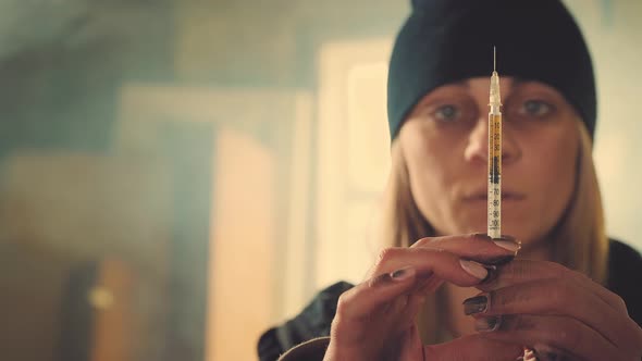 Woman with Syringe in an Abandoned House