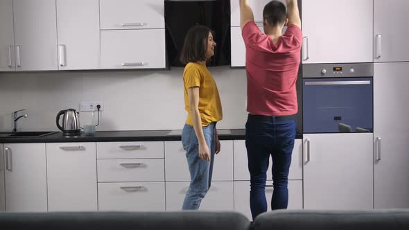 Hipster Newlyweds Celebrating at Home with Dance