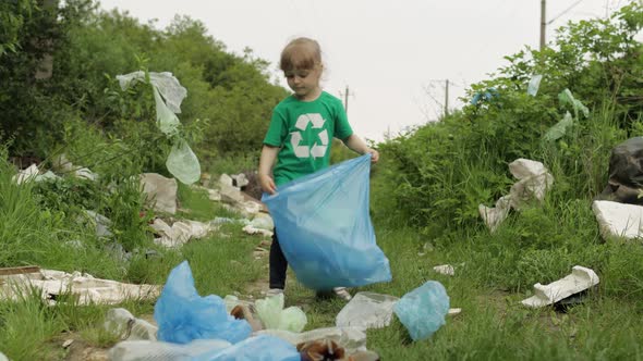 Volunteer Girl Cleaning Up Dirty Park From Plastic Bags, Bottles. Reduce Trash Nature Pollution