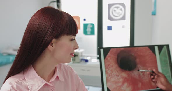 Close Up Portrait of Caucasian Woman Patient Sitting in Hospital Cabinet at