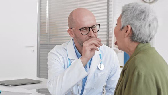 Doctor Checking Throat of Patient