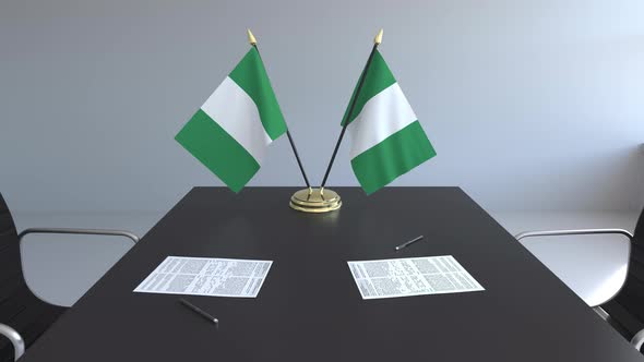 Flags of Nigeria and Papers on the Table