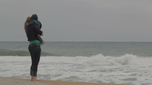 Mother with child, sea beach