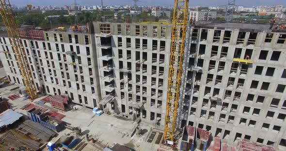 Unfinished Apartment Complex with Builders on the Top, Aerial alt