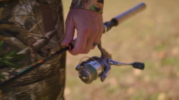 Man walking with fishing rod. High Speed/Slow Motion