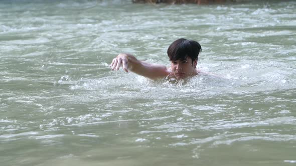 Asian Man Swim In Nature Swimming Pool