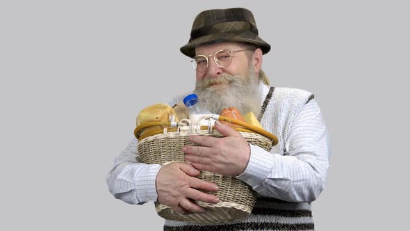 Old Retired Man Enjoying Smell of Food